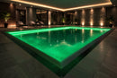 RGBW LED Swimming Pool Light Strip - Side Bend installed along indoor pool perimeter, providing uniform architectural LED strip lighting for spa and residential projects.