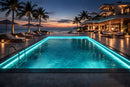 RGBW LED Swimming Pool Light Strip - Side Bend installed along seaside villa pool perimeter, providing uniform architectural LED strip lighting for outdoor residential projects.