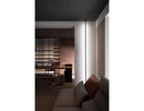 Round wall-mounted LED strip light using black aluminum channel, creating indirect wall wash lighting in a modern architectural interior