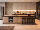 Warm white Surface Mount Under Cabinet Light installed beneath modern kitchen cabinets, delivering continuous and shadow-free illumination across the backsplash and countertop. The seamless linear lighting enhances task visibility while complementing the minimalist cabinetry and spacious kitchen island, making it an ideal lighting solution for residential and commercial architectural kitchen projects by GL LED US LIGHTING.