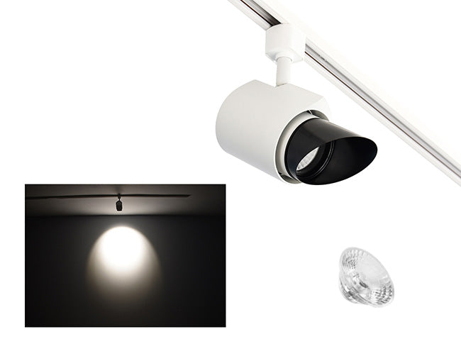 The image showcases the lighting effect produced by a white color track light with ovalsnoot and a 24° lens, revealing a distinct circular bright spot on the wall targeted by the track light.