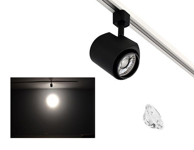 The image showcases the lighting effect produced by a black standard track light with a 15° lens, revealing a smaller and brighter circular light spot on the wall targeted by the track light.