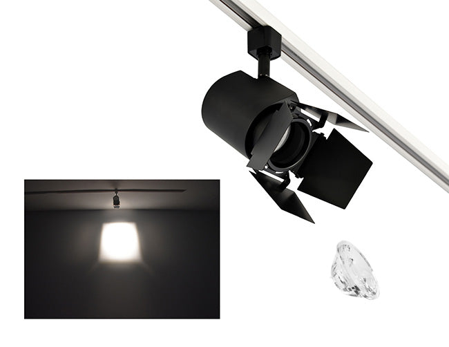 The image showcases the lighting effect produced by a black color track light with a barn door and a 15° lens, revealing a distinct rectangular bright spot on the wall targeted by the track light.