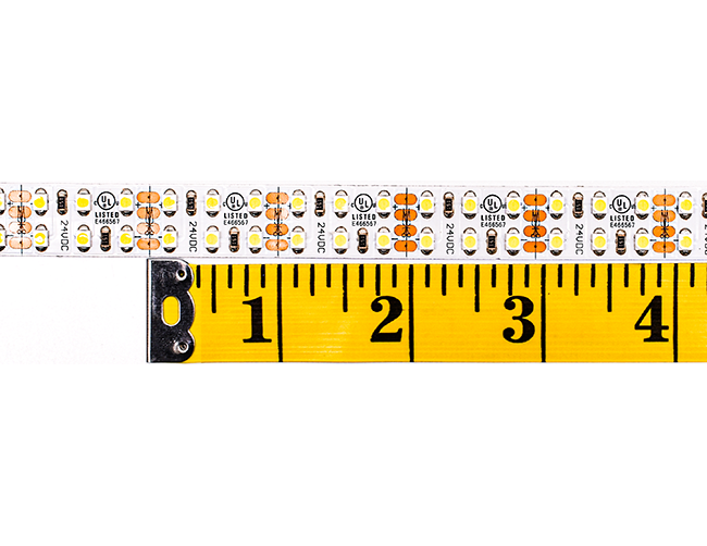 Clearance product LED Strip Light Single Color 3528-240-5500K-24V-IP20, with a measure tape showing a cutting distance is 1". 