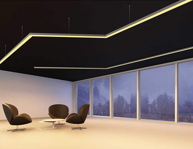 Suspended LED linear lights using ES-3535 aluminum channel illuminate a living area.