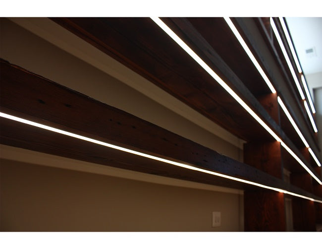 LED strip light fixtures using slim recess YD 1201 channels are installed under shelves to illuminate displayed items.