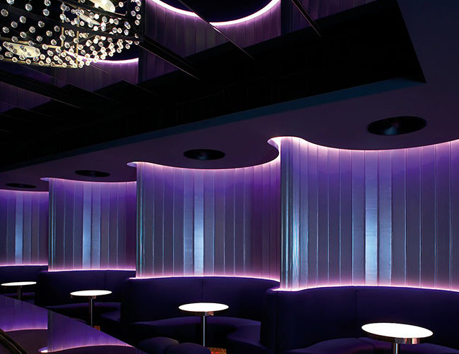 RGB LED Strip Light with Wave Effect in Bar Installation – Vibrant color-changing LED tape light creates stunning wave-like lighting effects, enhancing the ambiance of bar counters, ceilings, and walls while adding dynamic energy to the bar's overall atmosphere.