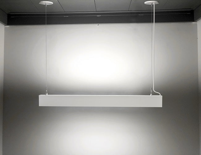 A white color GL LED L11070 linear light fixture is suspended from ceiling.