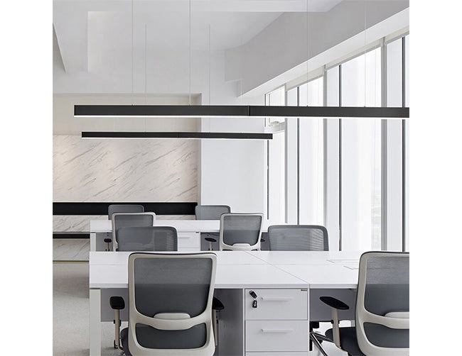 Black color GL LED L8050 4ft linear light fixtures suspended from ceiling illuminate a study room.