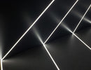 LED strip lights are used in an aluminum channel to create a unique lighting design.
