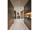 LED strip lights are used in an aluminum channel to illuminate a hallway.