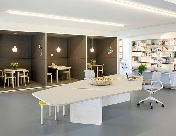 LED strip lights are used in an aluminum channel to illuminate an office.