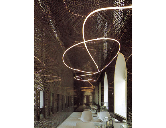 LED strip lights are used in a flexible aluminum channel to create a unique lighting design.