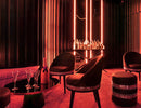 A lounge uses high voltage LED strip lights for cove lighting and a curated atmosphere.