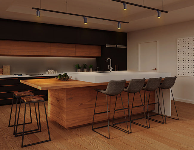 LED standard track lights illuminate a kitchen area.