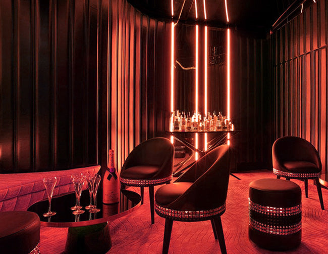 LED 3D neon lights are used to illuminate an indoor lounge area.