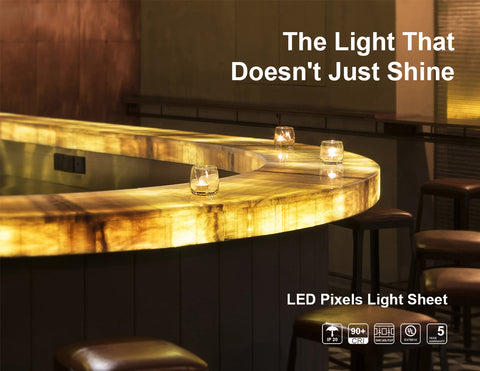LED pixels light sheets are installed to backlight countertops in a bar space. The internal texture of the stone countertop is well presented.