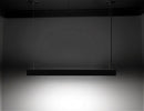 A black color GL LED L8050 linear light fixture is suspended from ceiling.