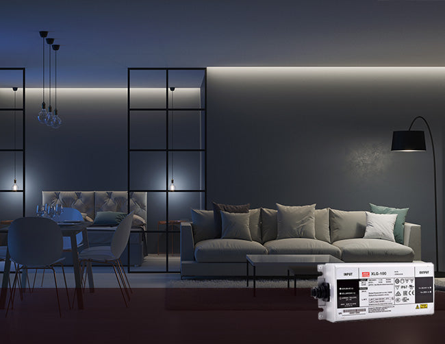 A cool toned living room is decorated with continuous LED strip lights that are powered by a low voltage power supply.