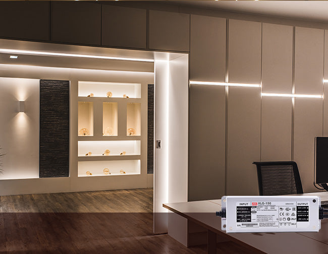 A lobby decorated with neutral colored continuous LED strip lights that are powered by a low voltage power supply.