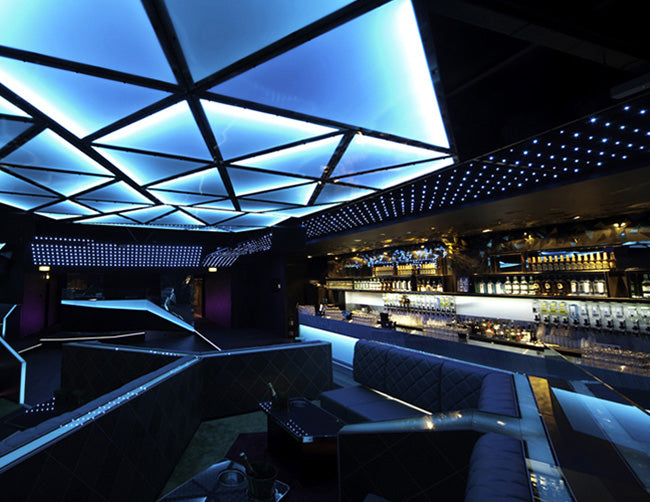 A restaurant and bar is decorated with RGB LED strip lights that are powered by a dimmable low voltage transformer.