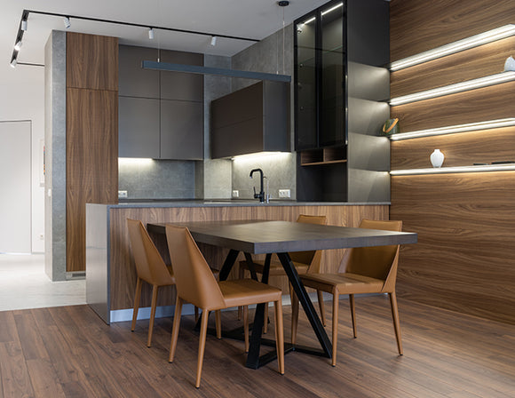 Undercabinet LED strip lights illuminate a kitchen area.